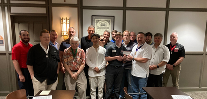 Grand Knight Michael Caturegli (front row, right) and other members of Holy Family Council 10388 in Tulsa, Okla., present a $3,000 check to Peter Sartorius, a seminarian for the Diocese of Tulsa and a parishioner of Holy Family Cathedral, to support his first year of formation. The donation came primarily from a pancake breakfast hosted by the council.