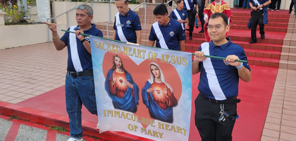 Members of Dededo (Guam) Council 10752 lead a procession at Santa Barbara Catholic Church celebrating the feasts of the Sacred Heart of Jesus (June 27) and the Immaculate Heart of Mary (June 28). The procession followed a June 28 Mass celebrated by Father Richard Kidd, parish administrator and council chaplain.