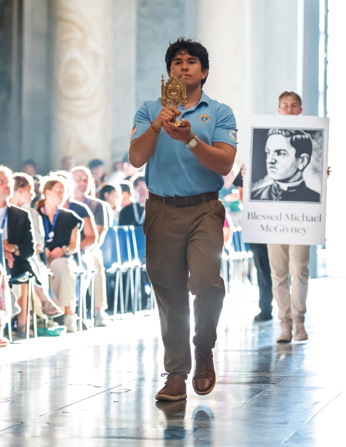 Members of the K of C College Councils Advisory Board carry a first-class relic and portrait of Blessed Michael McGivney