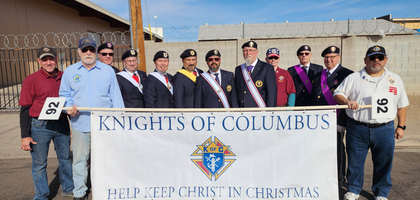Members of St. Joseph Assembly 2126 and Fray Francisco Garces Council 3855 in Glendale, Ariz., joined by Arizona State Deputy Tom Kato (fifth from left), gather to march in the Glendale Hometown Christmas Parade.