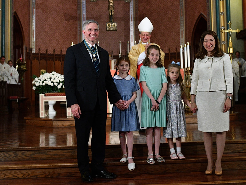 Image of Kelly family in front of the altar at St. Mary's Church in New Haven CT., during the installation ceremony