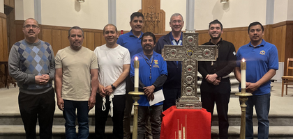 Kentucky State Deputy Luke Williams (third from right) and members of San Pablo Council 15707 in Lexington gather around a reliquary of six Mexican martyrs — all priests and Knights of Columbus — after a prayer service at St. Paul Church. 