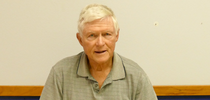 Bill Woster, a member of Father Emil Platte Council 5052 in Dallas, displays prayer books produced through the council’s prayer book ministry.