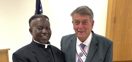 Faithful Navigator Mike Kelly of Father Francis Heindl Assembly 1902 in Tomah, Wis., presents a rosary to Father John Ofori-Domah — pastor of three local parishes and a member of the assembly — during its annual Clergy Appreciation Dinner, where he was the guest of honor. The assembly has organized the dinner for 30 years, and this year’s event raised $1,100 for the assembly’s seminarian scholarship fund and other projects.