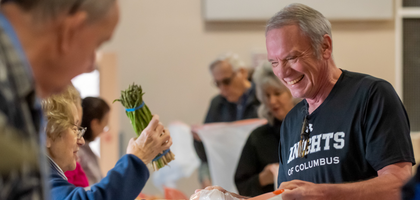 Rick Novak, a member of Patuxent Council 2203 in Laurel, Md., helps with an Easter food distribution where almost 4,000 pounds of food were given to nearly 600 people. 