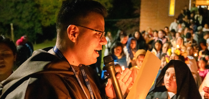 Miguel Flores, a field agent based in Winston-Salem, N.C., leads parishioners from St. Benedict the Moor Parish, including children dressed as saints and blesseds, in an All Saints’ Day candlelight procession. The event, organized by Santa Maria Council 2829, also included Mass, followed by food and games. (Photo by Brent Clark)