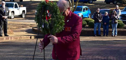 Bruce Hutchison, faithful purser of Father Henry Tevlin Assembly 2108 and a U.S. Army veteran, places a wreath honoring the Army at Forest Hills Cemetery in Rock Hill, S.C., while members of Assembly 2108 and St. Michael the Archangel Assembly 3696 in Lake Wylie stand at attention. For the past three years, the assemblies have worked with Wreaths Across America to organize an annual wreath-laying ceremony. Knights and other volunteers placed more than 140 wreaths on veterans’ graves.