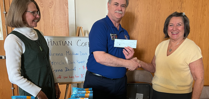 Grand Knight George Costigan of St. Thomas à Becket Council 9781 in Reston, Va., presents a $500 check to support a parish fundraiser for Bercy School, a Catholic high school in Haiti. St. Thomas à Becket Parish has supported the school for 15 years, providing supplies, meals and more. The council also donated $500 checks to three Diocese of Arlington seminarians through the Order’s Refund and Support Vocations Program (RSVP).