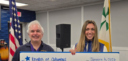 Grand Knight Tom Berry of South Plainfield (N.J.) Council 6203 presents a $5,000 check to Gabby Heverin, event associate for the Make-A-Wish Foundation of New Jersey. The council donated $4,000 — proceeds from its annual trivia night fundraiser — with the remainder coming from the Church of the Sacred Heart’s Social Concerns Ministry and a private donor.
