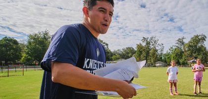 José Silva of St. Margaret of Scotland Council 17202 in Foley, Ala., scores participants during a Knights of Columbus Soccer Challenge at St. Benedict Catholic School in Elberta. Students from several area schools participated in the event. (Photo by Dan Anderson)