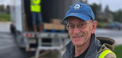 Gary Frank of Holy Redeemer Council 12899 in Vancouver, Wash., seals up a box of food donations for Clark County Food Bank. Knights and their family members volunteered at one of several drop-off locations during a citywide food drive, unloading more than 6,000 pounds of food donations from cars and boxing up the food for delivery to the food bank.