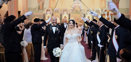 Fourth Degree Knights from St. John Paul II Assembly 3325 and All Saints of China Assembly 3484 in Markham, Ontario, extend a sword arch as Past Grand Knight Tarek Marroushi of Jesus the King Arab Christian Council 15045, and his wife, Mirai, process out of St. Mary’s Ukrainian Church in Mississauga following their nuptial Mass.