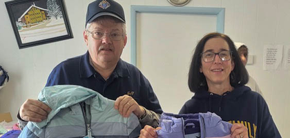 Grand Knight Jeff Meeh of Our Lady of the Sacred Heart Council 4282 in Nazareth, Pa., and Kathi Morris of Holy Family Parish hold winter jackets during the council’s Knights of Columbus Coats for Kids distribution. The council donated nearly 100 coats to children and families in need through the parish’s Kids Clothing Closet. The council spent $1,250 to purchase four boxes of coats, and the Pennsylvania State Council matched the donation with four additional boxes.