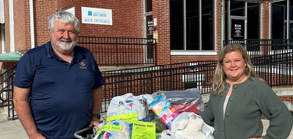 Financial Secretary Mark Hackert of St. Benedict Cathedral Council 7544 in Evansville, Ind., delivers donated pairs of new underwear to Katie Grunow, executive director at Evansville Christian Life Center. The council’s drive at St. Benedict Cathedral collected more than 700 pairs of underwear for distribution through the center’s clothing bank.