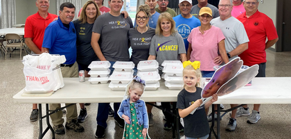Members of Red Church Council 3634 in Norco, La., gather with the family of Amelia Hindman, a 4-year-old girl diagnosed with an inoperable cancer, during a fundraising dinner organized by the council. The event raised $12,000 to support her treatment.