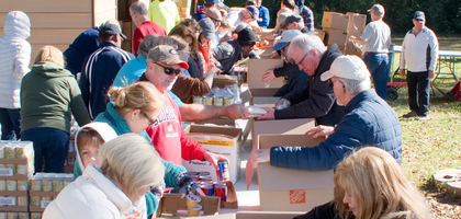 Members of St. Joseph Council 4599 in Marietta, Ga., and volunteers from the St. Vincent de Paul Society at St. Joseph Parish pack Thanksgiving food boxes to be given to families in need in Cobb County. 