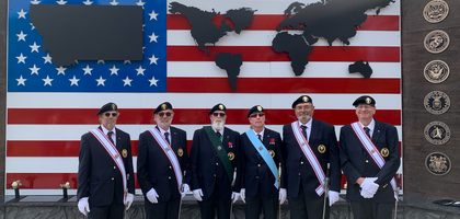 Knights from Father Pauwelyn Assembly 587 in Billings, Mont., stand before a new memorial honoring the nearly 50 service members from Montana killed in action since the Vietnam War.