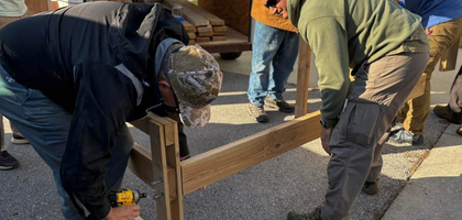 Members of Father O’Byrne Council 3574 in Jacksonville, N.C., and Father Aloysius H. Schmitt Council 13220 in Camp Lejeune construct a bed during a Sleep in Heavenly Peace build at Infant of Prague Catholic Church. Over one week, Knights helped build 46 beds, which were delivered with mattresses, sheets, pillows and blankets to families in need. In the past three years, Council 3574 has helped build and distribute more than 300 beds with SHP.