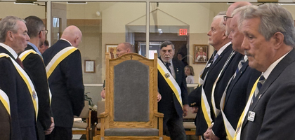 Members of Holy Spirit Council 10502 in Palmyra, Pa., provide an honor guard as Past Grand Knight Jack Yanni carries a new presider’s chair into the sanctuary of the Church of the Holy Spirit. Joseph Spear, a brother Knight and woodworker, spent several years crafting liturgical furnishings for the parish. He had planned to build new sanctuary chairs but died of cancer in 2024. In his honor, his family raised $4,300 — including $500 from the council — to complete the project. The chairs were later blessed by Father Michael Metzger, pastor and council chaplain, during a Sunday Mass.