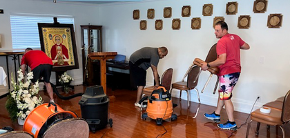 Members of St. Oscar Romero Council 16570 in Eastvale, Calif., clean St. Oscar Romero Church’s chapel after a leak in the water heater line caused flooding.