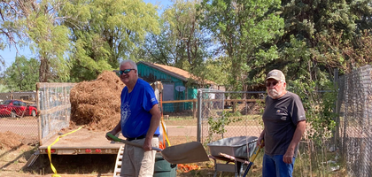 Knights from Bishop Jerome J. Hastrich Council 12078 in Show Low, Ariz., and St. Mary of the Angels Council 7912 in Pinetop clean the grounds of St. Anthony Parish in McNary. Council members spent about eight hours filling a trailer with weeds, branches and other debris during the councils’ cleanup day.