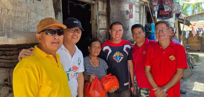 Members of St. Elizabeth of Hungary Council 16272 in Malolos, Luzon North, deliver bags of food to a woman for her family’s Christmas celebration. The council spent 8,225 PHP (about $140) to give bags of food — containing rice, canned goods, noodles and more — to 20 families in need.