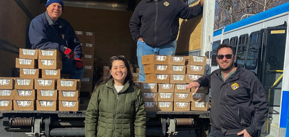 Past Grand Knight Carl Williams Jr. (center) and District Deputy Steve Merschen (right) of John Paul the Great Council 486 in Middletown, N.Y., deliver pallets of prepackaged meals to James Banville (left), district deputy and financial secretary of Monroe Council 2079, and a parishioner at Sacred Heart Church’s food pantry. Knights from Council 486 coordinated the delivery of 50,400 meals — provided by an anonymous donor — to food pantries at four local parishes.