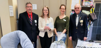 Randy Wilkes (left) and Brian King of Mid-Island Council 3842 in Nanaimo, British Columbia, deliver a truckload of supplies and CA$2,500 in cash donations to staff from Crossroads Pregnancy Centre. Since the donation was made through the ASAP program, Crossroads will receive additional aid from the Supreme Council.