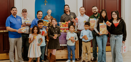 Knights and family members of St. Joseph Council 7662 in Dalton, Ga., display food collected during the first weekend of the 40 Cans for Lent drive organized by the council at St. Joseph Church. 