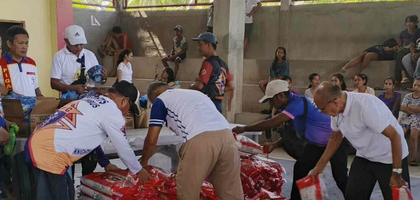 Knights from Magallanes (Mindanao) Council 7885 distribute bags of rice to families in need at Nuestra Señora del Rosario Parish. The council collaborated with Marian Council 5748 in Manchester, N.H., which raised $2,500 to provide rice, canned goods and noodles to about 230 families in need.