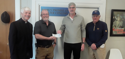Members of  St. Mary Council 13095 in Hillsborough, N.H., present Stephen Croke (second from right), the director of Family Promise of Greater Concord, a check for over $1,500 — proceeds from the council’s annual St. Patrick’s Dinner. 