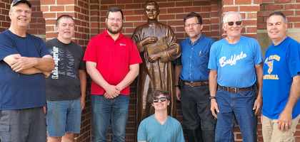 Members of St. Francis Xavier Council 6608 in Buffalo, Minn., gather in front of a new statue of Blessed Michael McGivney installed at St. Francis Xavier Catholic Church. 