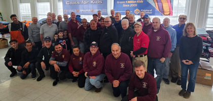 About 30 Knights from several councils in the greater Norwalk, Conn., area gather with volunteers at Family & Children’s Agency of Norwalk before distributing more than 1,100 new coats, gloves and hand-knit winter hats to clients. Father Frank Hoffman, pastor of St. Matthew Church and chaplain of St. Matthew Council 14360, blessed the coats before distribution.