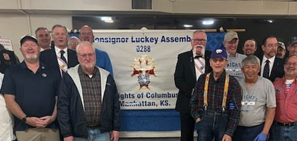 Knights from Msgr. Luckey Assembly 288 in Manhattan, Kan., gather before cooking and serving food at the assembly’s annual Veterans Day Breakfast. More than 250 veterans and community members attended the event, which the assembly has sponsored for more than 15 years.