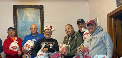 Members of Francis Cardinal Brennan Council 618 in Shenandoah, Pa., display donations collected during the council’s annual Christmas food drive. More than 500 pounds of turkey, canned goods, bread and more were given to 25 families in need identified by the Shenandoah Valley School District.