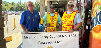 Members of Msgr. P.J. Carey Council 1605 in Pascagoula, Miss., solicit donations in front of a local grocery store for the council’s annual fund drive for people with disabilities.