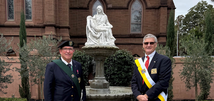 James Roche of Rev. P.N. Lynch Assembly 1071 and John Kenny of St. Finbar Council 17760 in Charleston, S.C., stand beside a fountain at the Cathedral of St. John the Baptist dedicated to children lost to miscarriage, stillbirth and abortion. Bishop Jacques Fabre-Jeune of Charleston blessed the fountain, which was funded, designed and installed by Knights.