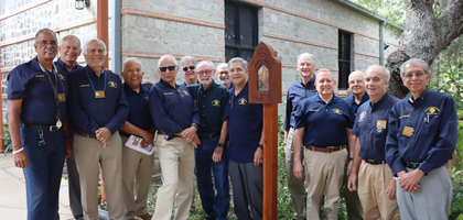 Members of St. Francis of Assisi Council 15240 in San Antonio gather behind one of the 14 new Stations of the Cross installed at St. Francis of Assisi Catholic Church.
