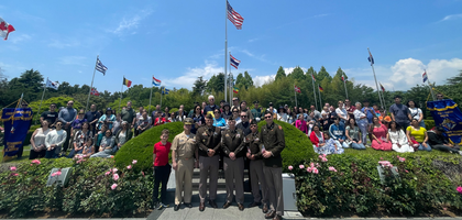 Knights from Bishop John J. Kaising Council 14223 and Bishop Joseph W. Estabrook Assembly 3348 in Camp Humphreys, Korea, gather at the United Nations Memorial Cemetery in Busan after wreath-laying ceremonies honoring American service members of the Korean War.