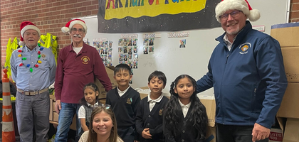 Knights from St. Mary Magdalen Council 16223 in Kentwood, Mich., gather with students and staff at San Juan Diego Academy after delivering several boxes of toys. The council held a drive at St. Mary Magdalen Parish that collected about 400 toys valued at $6,120 for children at St. Joseph the Worker Catholic Church.