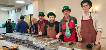 Knights from St. Matthew Council 14360 in Norwalk, Conn., serve food during the council’s annual St. Patrick’s Day fundraising dinner.