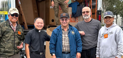 Members of Good Shepherd Council 9076 in San Diego stand with Father John Phan, parochial vicar of Good Shepherd Parish and council chaplain, after loading a truck with more than 2,000 pounds of clothing and hygiene products. The items were collected during the council’s drive for Father Joe’s Villages, a nonprofit that provides services for people experiencing homelessness.