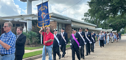 Members of Msgr. Anthony Piegay Assembly 328 in Alexandria, La., provide an honor guard to lead St. Frances Cabrini Church’s Corpus Christi procession. Assembly 328 provided honor guards for two other processions in the area: one on Thursday, June 19, at the Minor Basilica of the Immaculate Conception in Natchitoches and another on Corpus Christi Sunday, June 22, at St. Francis Xavier Cathedral in Alexandria.