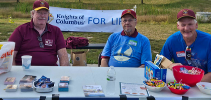 Grand Knight Paul Tavana (right) and other members of Dexter (Mich.) Council 2959 staff a table with pro-life resources at the Walk for Life organized by Family Life Services of Washtenaw County at Montibeller Park. The council has supported the event for the past three years and donated more than $7,700 to the pregnancy resource center.