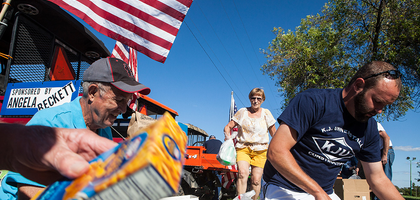 Knights place food in boxes outdoors.