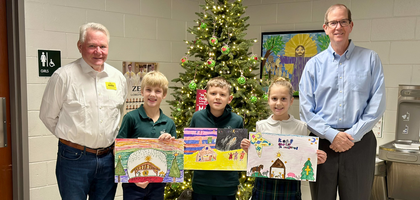 Grand Knight John Rosing (left) and Deputy Grand Knight Steve McGuire of St. Pope John XXIII-Mequon (Wis.) Council 5438 stand with winners of the council’s annual Keep Christ in Christmas Poster Contest.