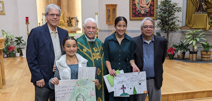 Grand Knight Larry Fernandez (right) and Financial Secretary Knight Brian Noon of Robert G. Gamboa Council 9527 in Las Cruces, N.M., gather with two winners of the council’s Keep Christ in Christmas Poster Contest. About from grades 6-8 participated.