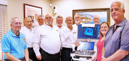 Knights from Orange Park (Fla.) Council 7399 and Most Holy Redeemer Council 17029 in Jacksonville gather near a new ultrasound machine purchased by the councils for the Jacksonville Westside location of Women’s Help Center.