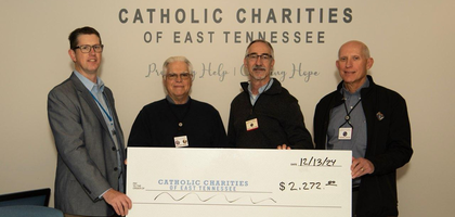 Grand Knight Mike Perry (second from left) and other members of George S. Kurtz Council 12961 in Seymour, Tenn., present a check for more than $2,200 to Andrew Kaleida (left), development director for Catholic Charities of East Tennessee. 