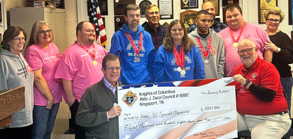 Knights from Aldo J. Zazzi Council 6992 in Kingsport, Tenn., present a grant check for nearly $9,000 to Kelly Middleton (second from left), Area 32 director for Special Olympics Tennessee, and Special Olympics athletes. 